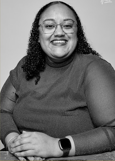 Gail DeShields of Towson University. She is against a grey background wearing a dark grey blouse.